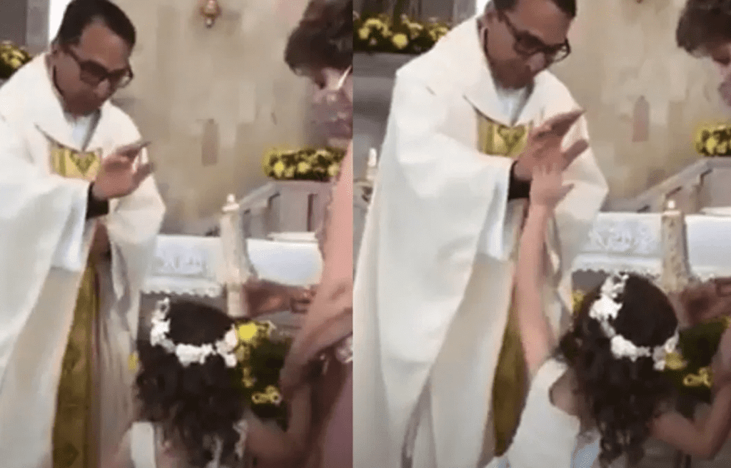 ¡Chócalas! hace niña a sacerdote cuando le da la bendición, y se viraliza #VIDEO