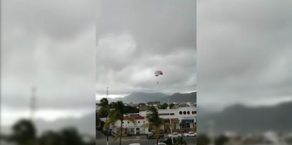 Turista cae de parachute a cables de alta tensión #VIDEO