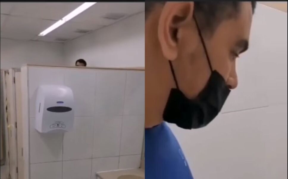 Hombre espía en el baño de damas