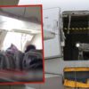 Una persona abre puerta de avión en el aire