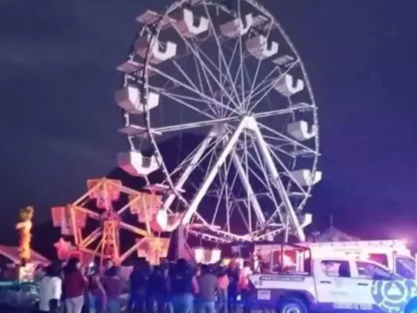 Padre e hija caen de 15 metros de rueda de la fortuna