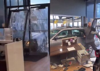 Hombre estrella auto contra concesionaria