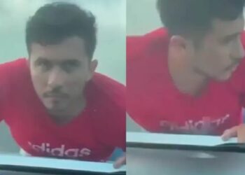 Ratero se queda colgado del cofre de un auto